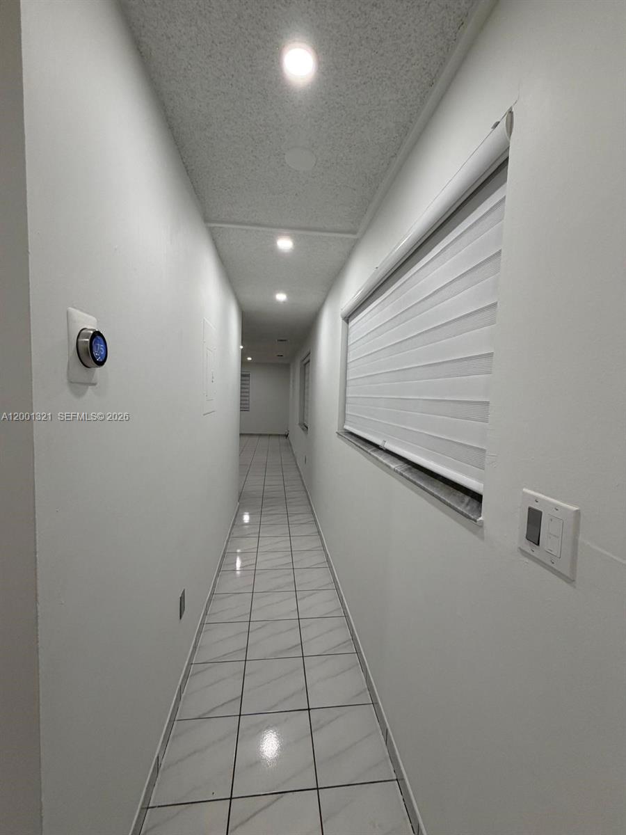 11511 Southwest 180th Street Miami, FL 33157 - Photo 19 of 22 a view of a hallway