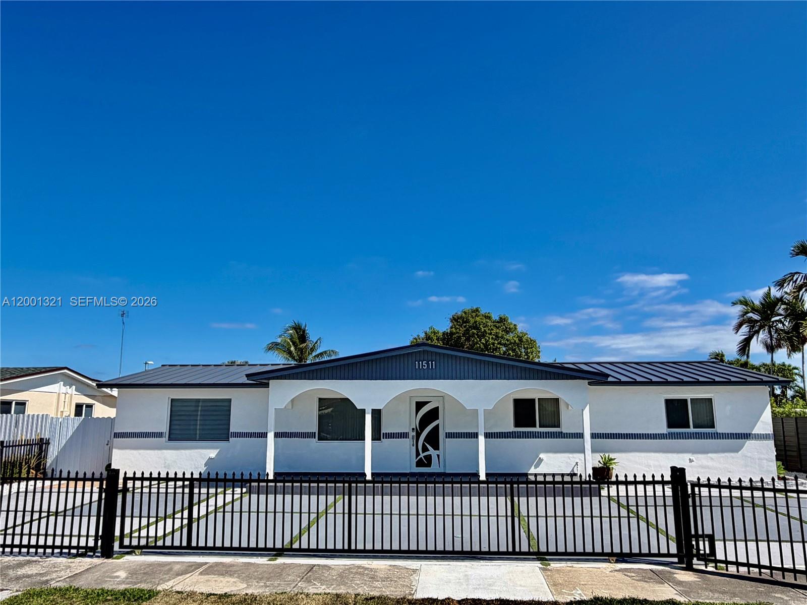 11511 Southwest 180th Street Miami, FL 33157 - Photo 2 of 22 front view of a house