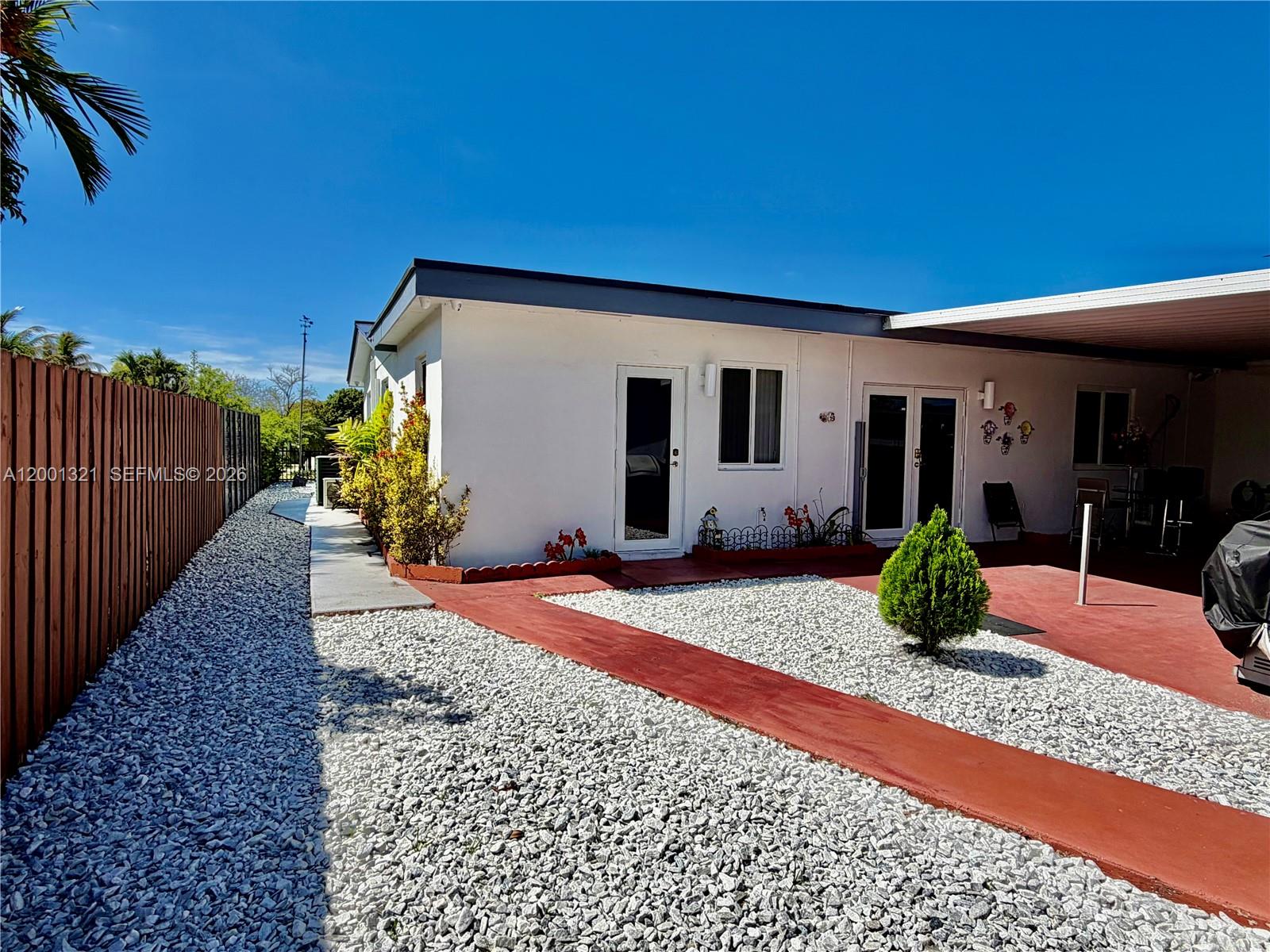 11511 Southwest 180th Street Miami, FL 33157 - Photo 4 of 22 a view of a house with backyard