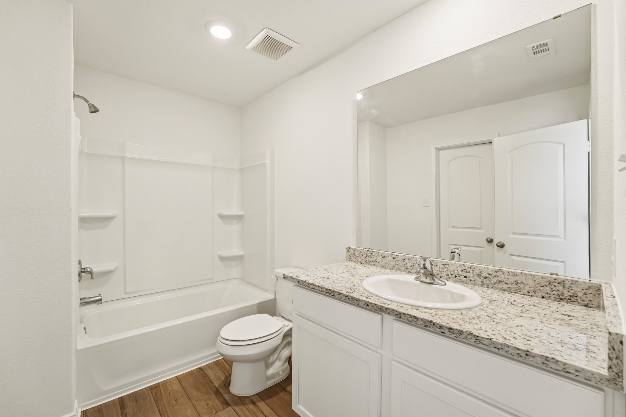 571 Aplite Pass Maxwell, TX 78656 - Photo 25 of 28 a bathroom with a granite countertop sink toilet and shower