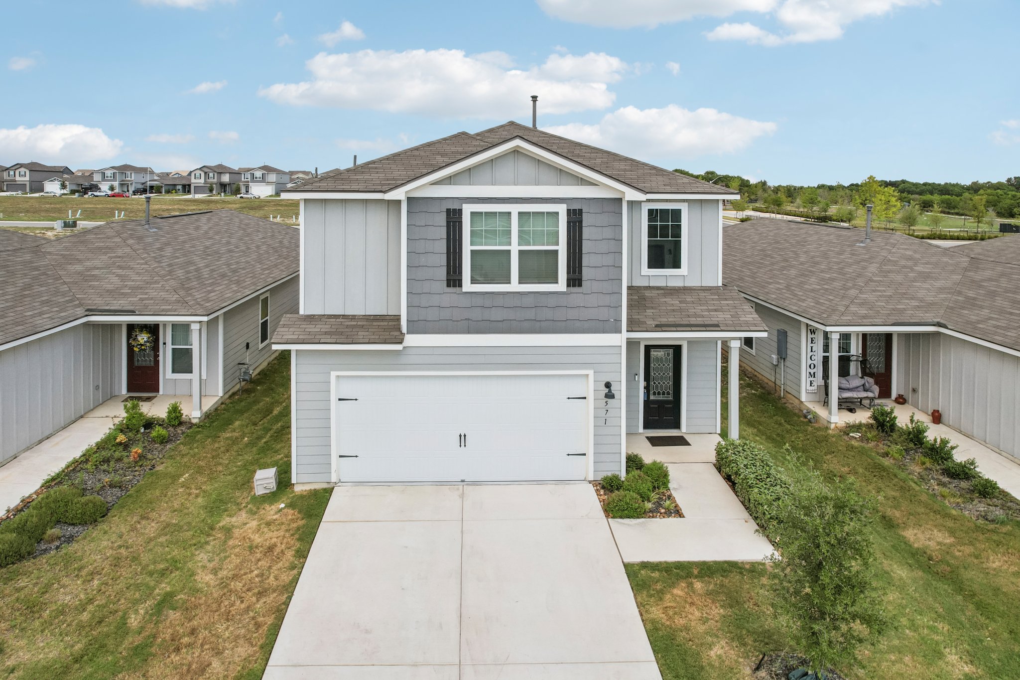 571 Aplite Pass Maxwell, TX 78656 - Photo 3 of 28 front view of a house with a yard