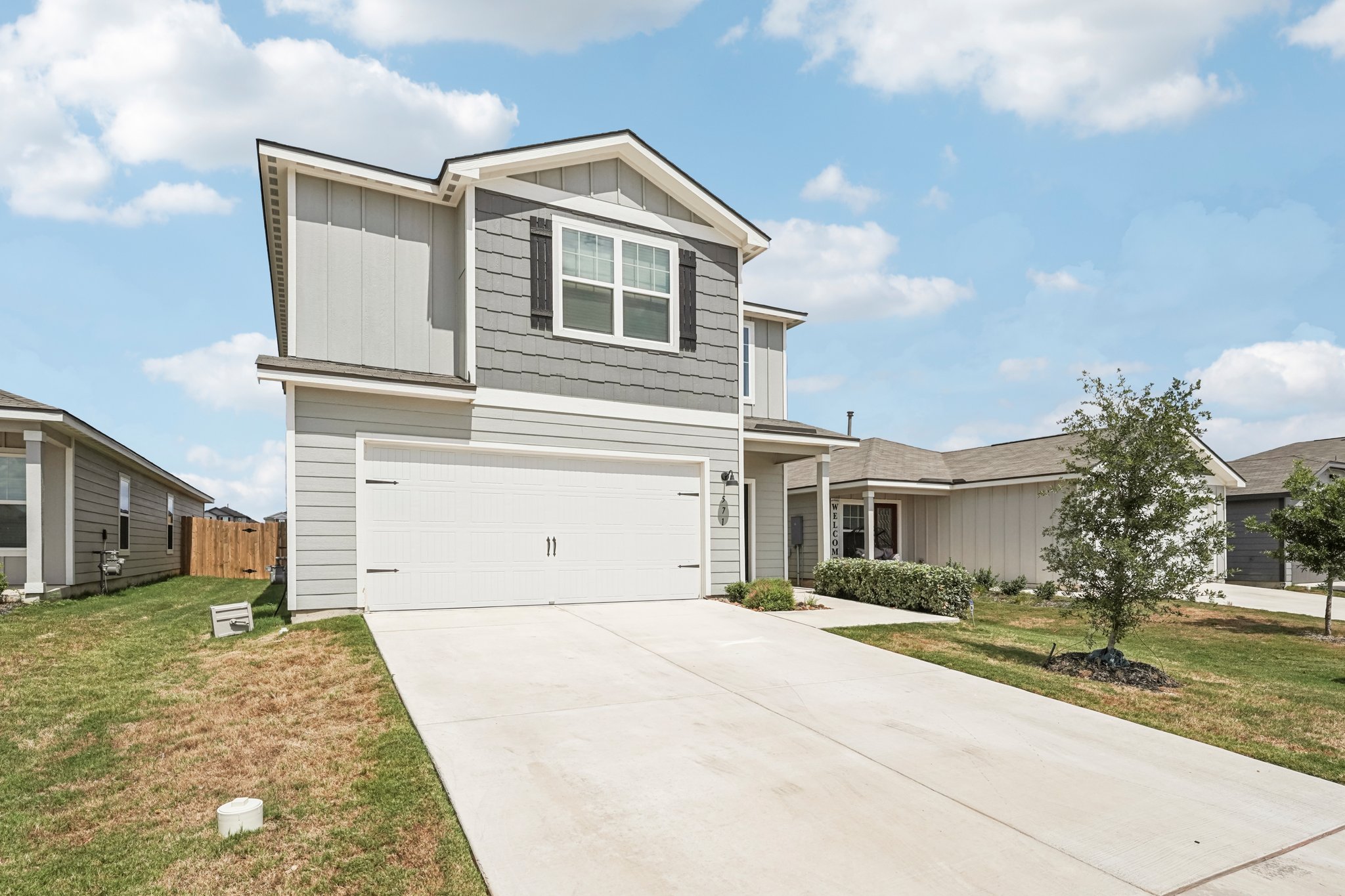 571 Aplite Pass Maxwell, TX 78656 - Photo 6 of 28 a front view of a house with a garden