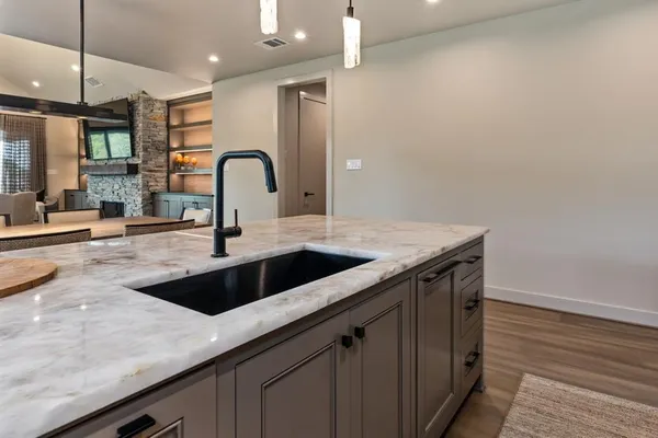 a kitchen with a sink and cabinets
