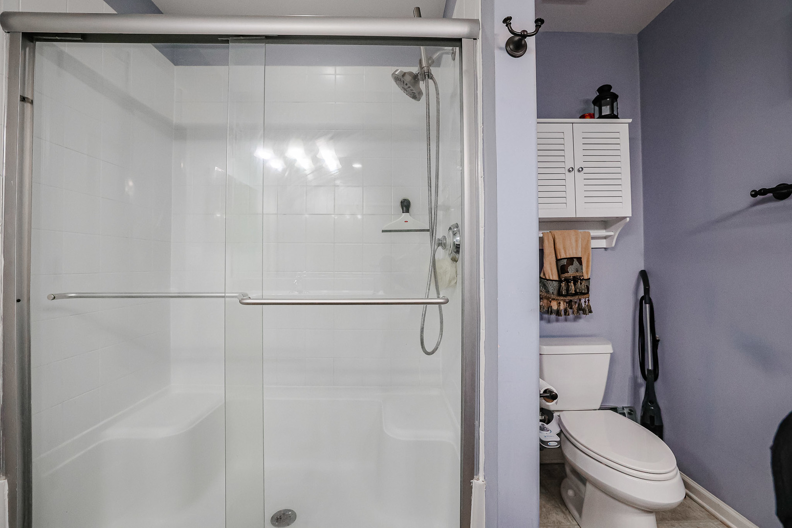 1322 Tamarack Drive Bartlett, IL 60103 - Photo 27 of 30 a bathroom with a shower a toilet and a shower