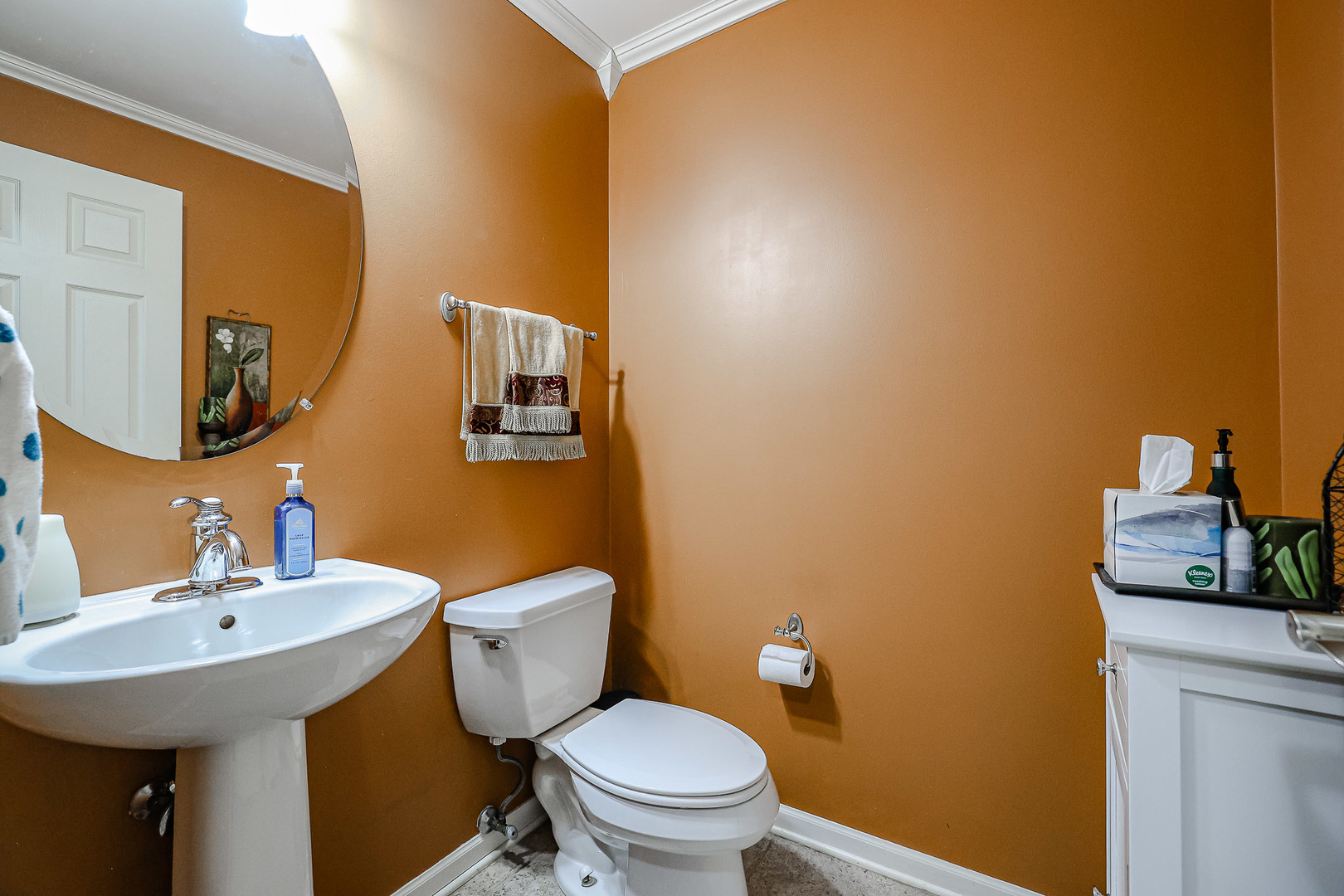 1322 Tamarack Drive Bartlett, IL 60103 - Photo 6 of 30 a bathroom with a toilet a sink and mirror