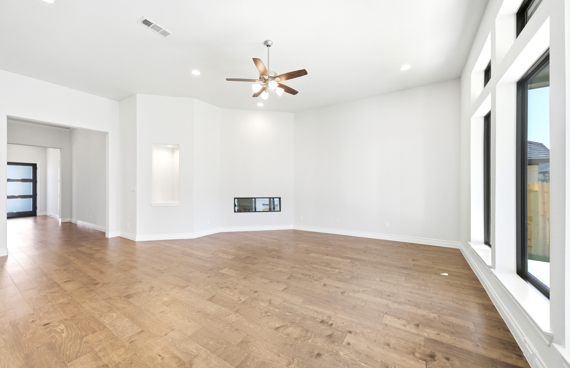 38642 Night Brood Court Magnolia, TX 77354 - Photo 15 of 32 wooden floor in an empty room with a window