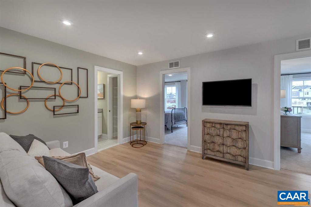 2837 Rambling Brook Lane Crozet, VA 22932 - Photo 15 of 24 a living room with furniture and a flat screen tv