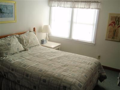 8 Sumac Road West Dennis, MA 02670 - Photo 20 of 23 a bedroom with a bed and a window