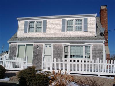 8 Sumac Road West Dennis, MA 02670 - Photo 2 of 23 a front view of a house with a garden