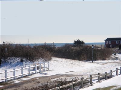 8 Sumac Road West Dennis, MA 02670 - Photo 4 of 23 a view of a road with a snow in the background