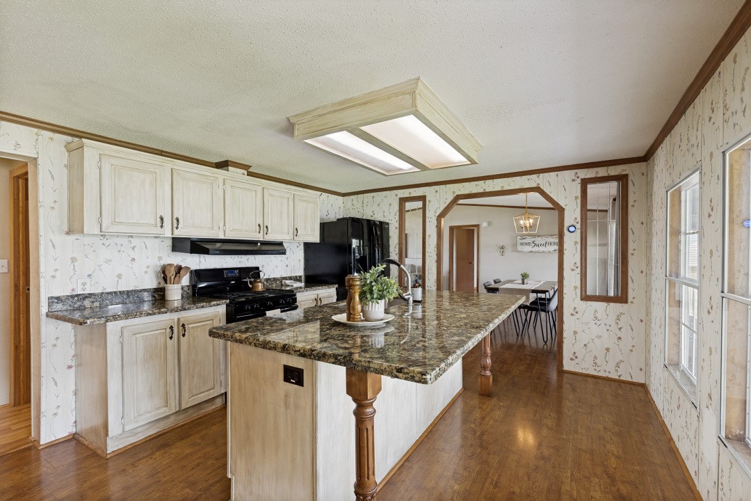 207 Vivian Road Onalaska, TX 77360 - Photo 12 of 34 a kitchen with stainless steel appliances granite countertop a sink refrigerator and cabinets