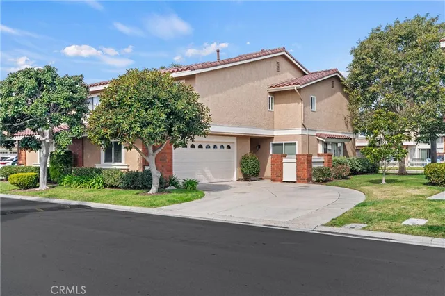 a front view of house with yard and green space