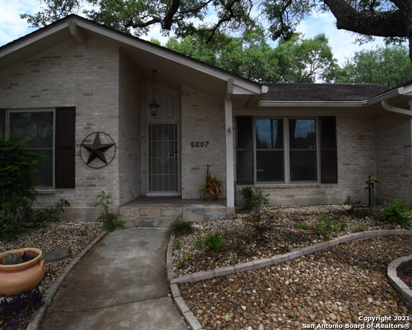 6207 Shady Brook Windcrest, TX 78239 - Photo 1 of 23 a front view of a house with garden