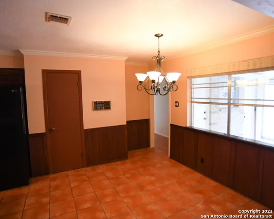 a bedroom with a bed dresser and a window