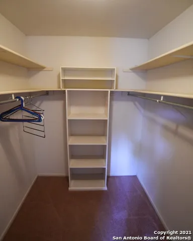 a view of an empty walk in closet