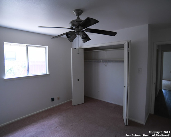 6207 Shady Brook Windcrest, TX 78239 - Photo 20 of 23 a view of an empty room with a window