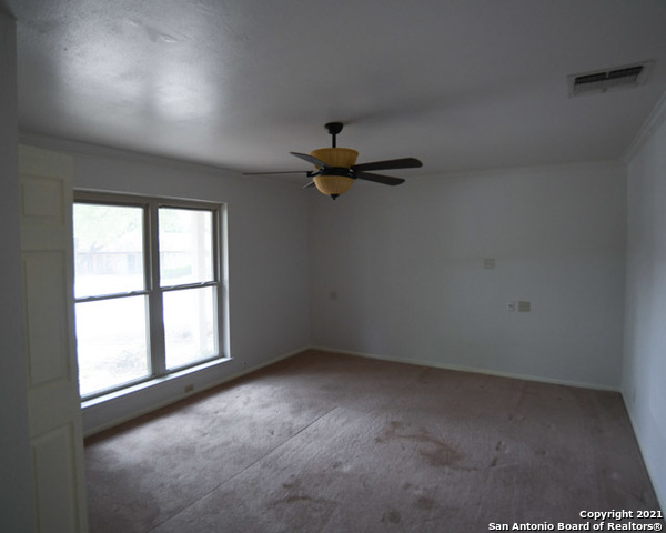 6207 Shady Brook Windcrest, TX 78239 - Photo 23 of 23 an empty room with a window