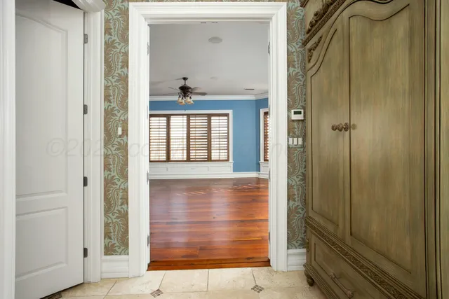 a bathroom with a granite countertop sink a mirror and shower