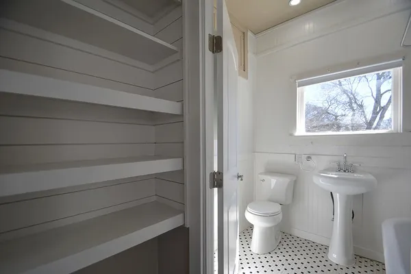 a bathroom with a toilet and a sink