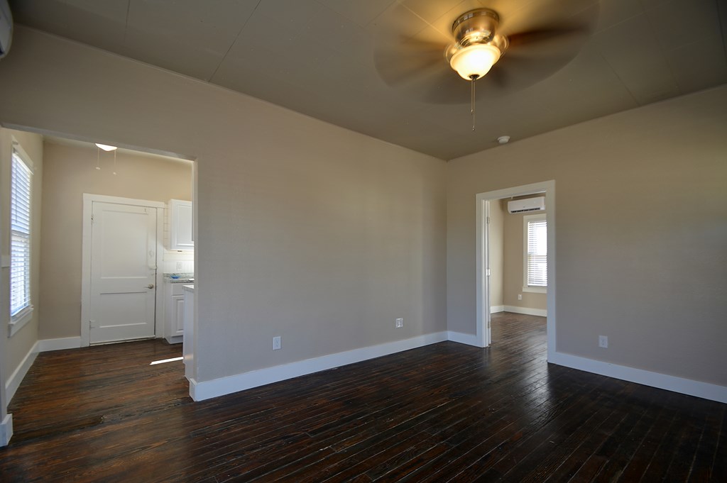 309 Lowry Street Kerrville, TX 78028 - Photo 5 of 29 a view of empty room with wooden floor