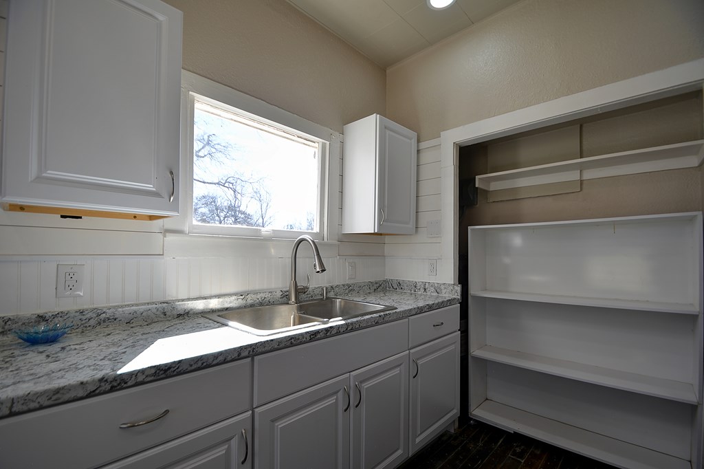 309 Lowry Street Kerrville, TX 78028 - Photo 9 of 29 a kitchen with a sink and a window