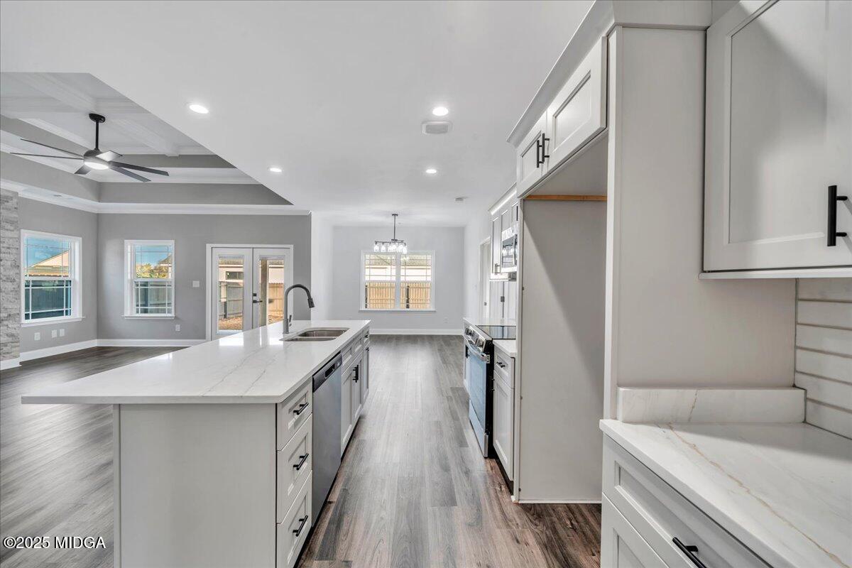 103 Early Drive Byron, GA 31008 - Photo 18 of 44 a bathroom with a granite countertop sink a toilet a shower and a mirror
