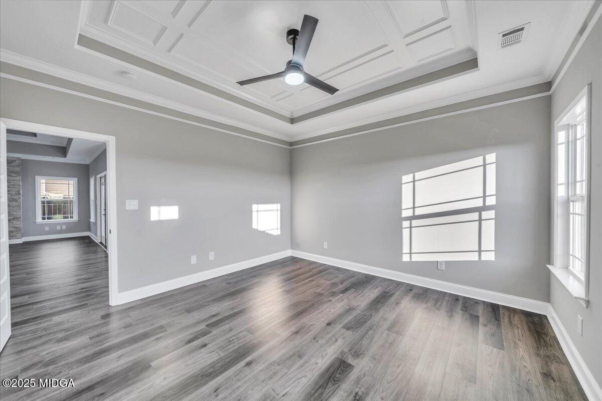 103 Early Drive Byron, GA 31008 - Photo 23 of 44 a view of an empty room with wooden floor and a window