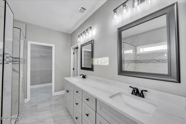a bathroom with a bathtub and a shower