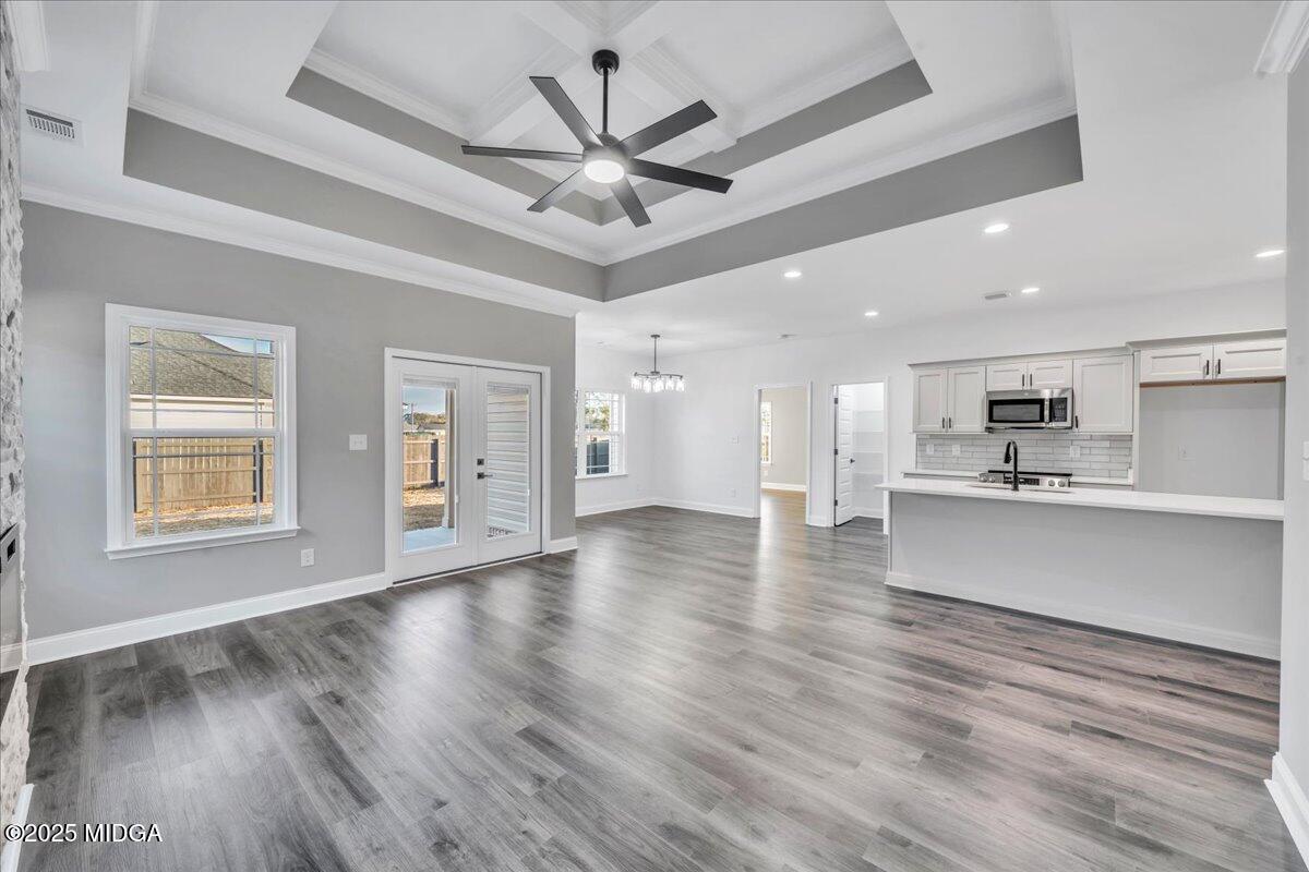 103 Early Drive Byron, GA 31008 - Photo 10 of 44 a view of an empty room with wooden floor and a ceiling fan
