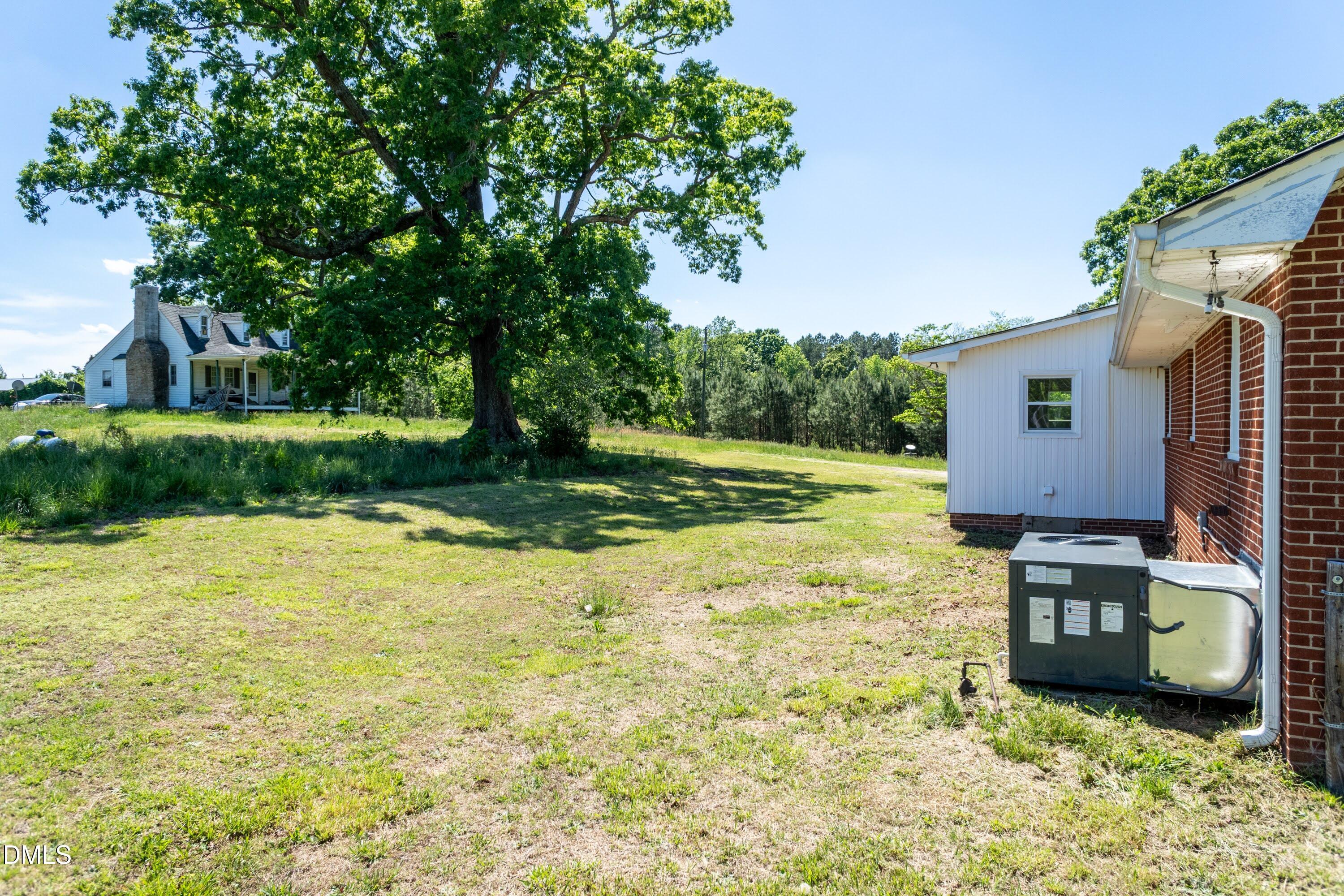 641 Rocky Ford Road Louisburg, NC 27549 - Photo 31 of 38 a house view with a garden space