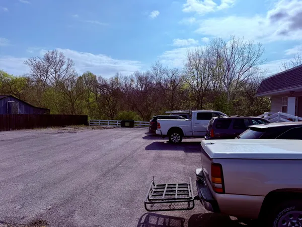 a view of a car parked on the road