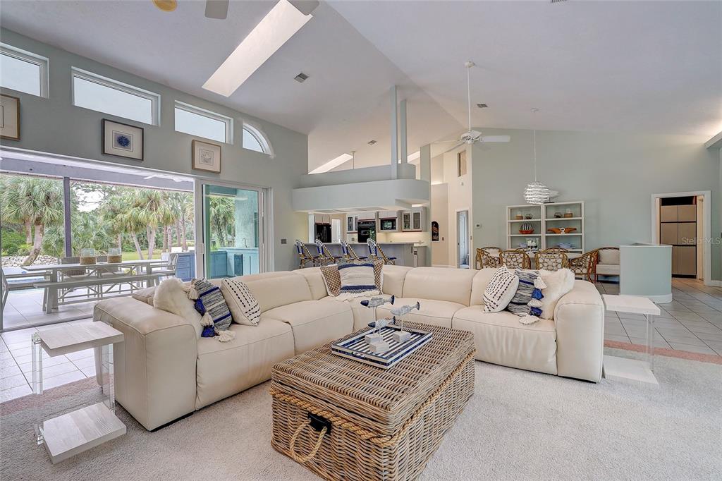 181 South Auburn Road Venice, FL 34292 - Photo 14 of 91 a living room with furniture and a large window