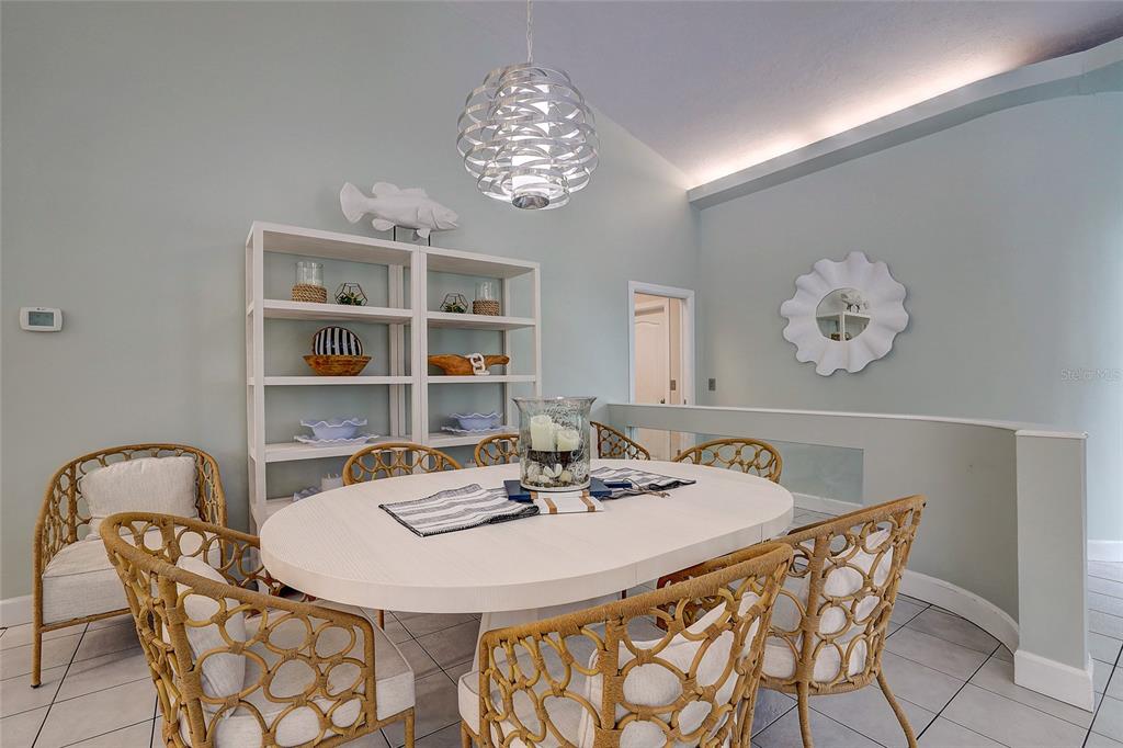 181 South Auburn Road Venice, FL 34292 - Photo 18 of 91 a dining room with furniture and chandelier