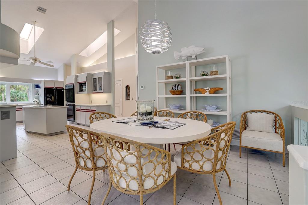 181 South Auburn Road Venice, FL 34292 - Photo 19 of 91 a view of a dining room with furniture and chandelier