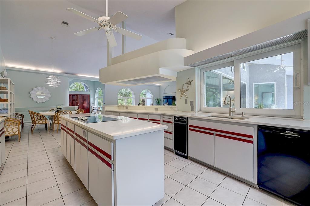181 South Auburn Road Venice, FL 34292 - Photo 23 of 91 a kitchen with stainless steel appliances granite countertop a sink and cabinets