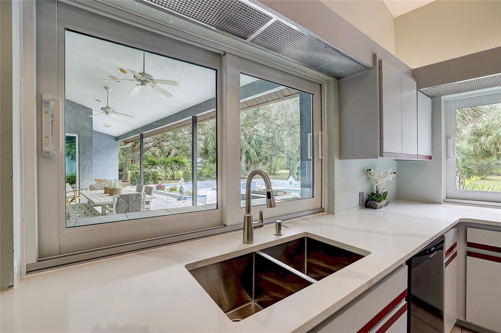 181 South Auburn Road Venice, FL 34292 - Photo 25 of 91 a kitchen that has a sink and a window