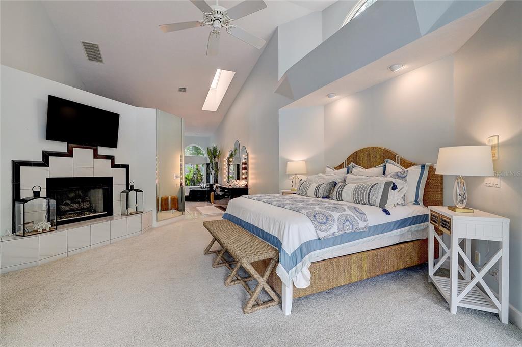181 South Auburn Road Venice, FL 34292 - Photo 37 of 91 a spacious bedroom with a bed and a flat screen tv