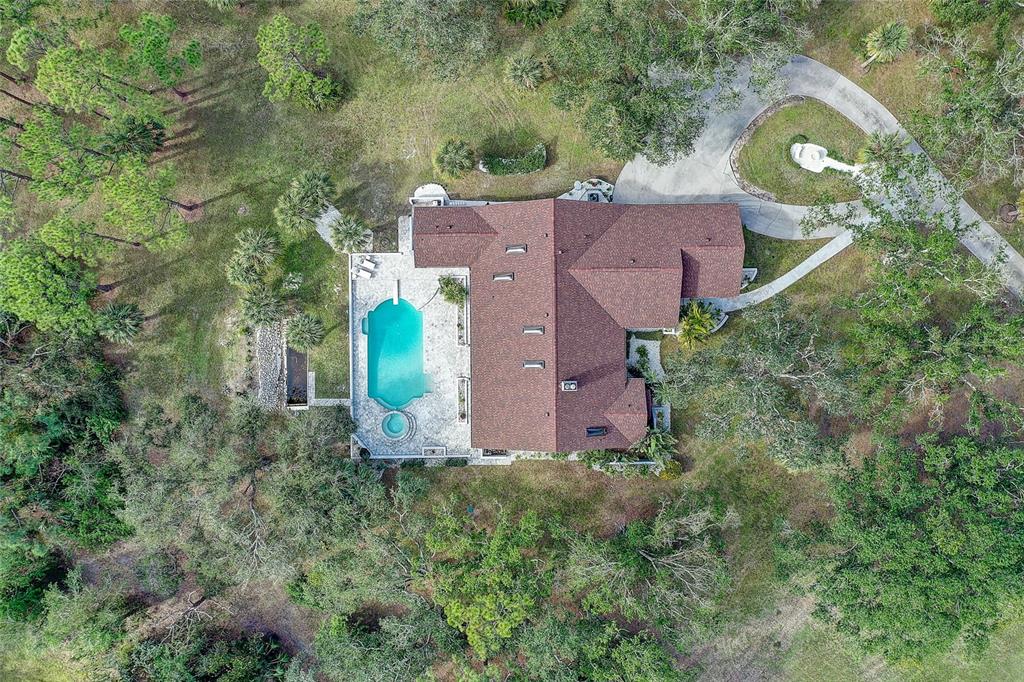181 South Auburn Road Venice, FL 34292 - Photo 81 of 91 an aerial view of a house with a garden
