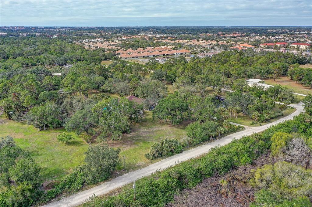 181 South Auburn Road Venice, FL 34292 - Photo 89 of 91 a view of a yard with a garden