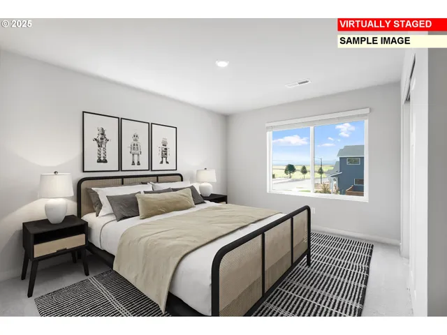 a bedroom with a bed and a painting on the wall