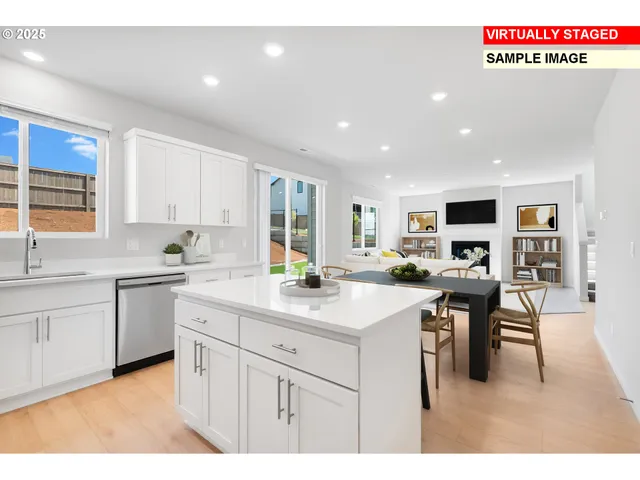 a kitchen with a sink stainless steel appliances and white cabinets