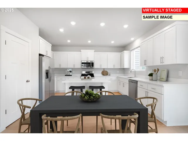 a kitchen with kitchen island a stove a table and chairs