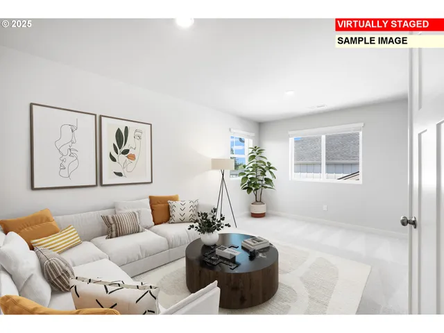 a living room with furniture and flowers