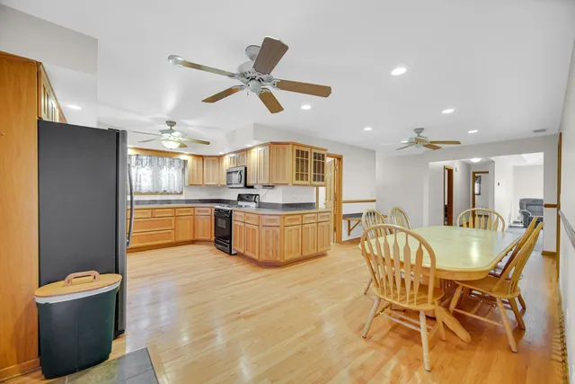 a kitchen with a table and chairs