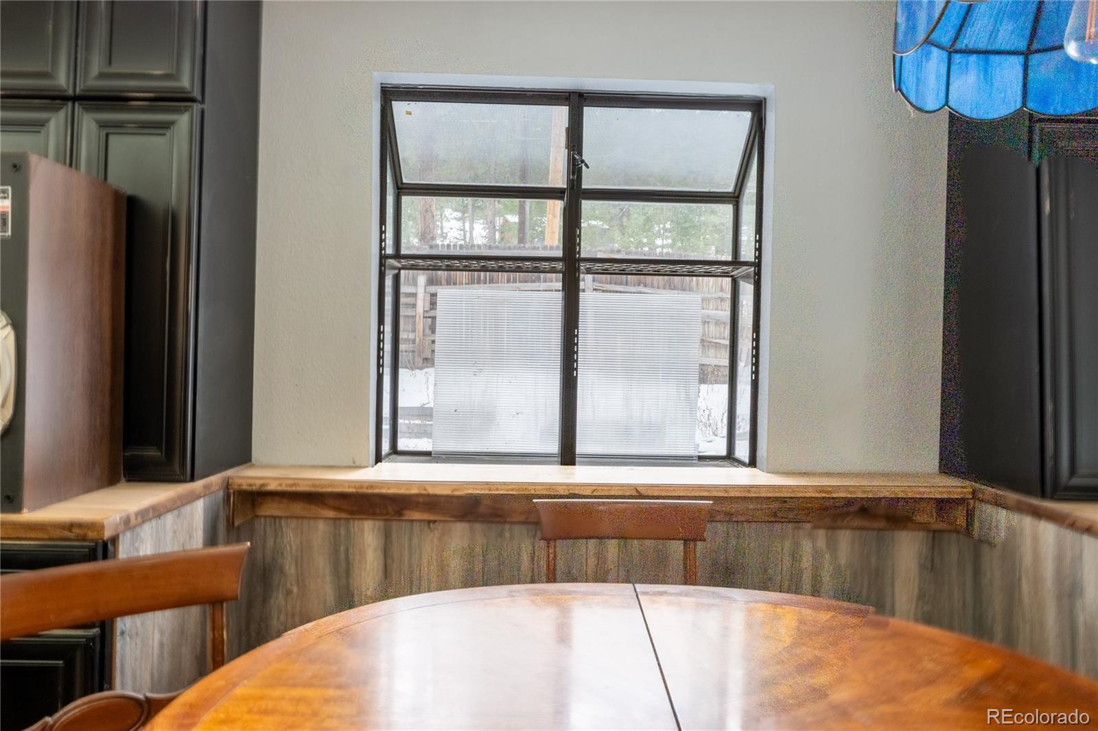 983 Wagon Trail Road Evergreen, CO 80439 - Photo 18 of 47 a view of a living room and a window