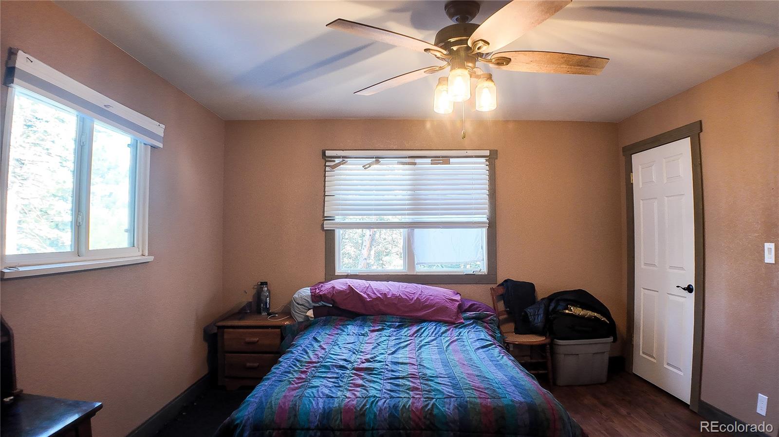 983 Wagon Trail Road Evergreen, CO 80439 - Photo 27 of 47 a bedroom with a bed and a window