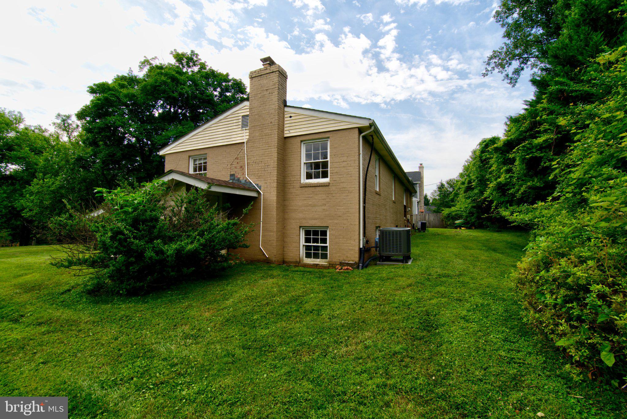 900 Walker Road Great Falls, VA 22066 - Photo 48 of 52 Charming home with lush green surroundings.