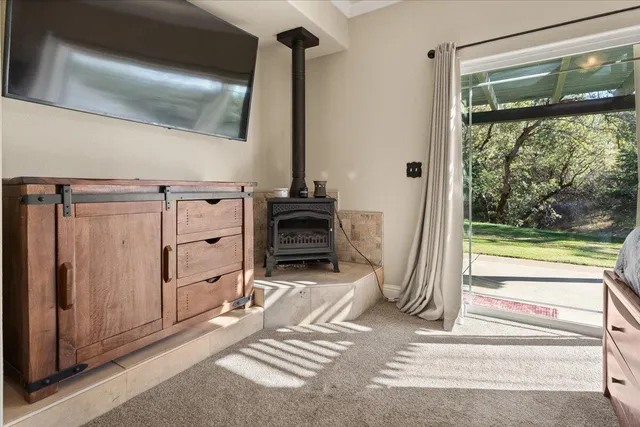 a bathroom with a granite countertop sink mirror vanity and toilet
