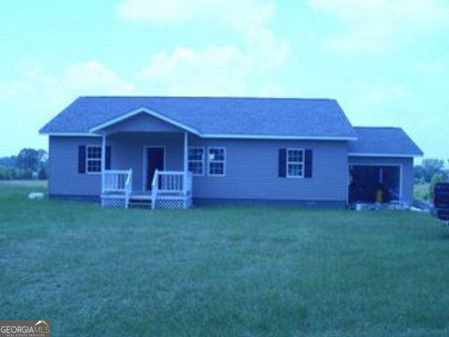 757 Jerry Talley Road Lyons, GA 30436 - Photo 1 of 1 a view of a house with a backyard