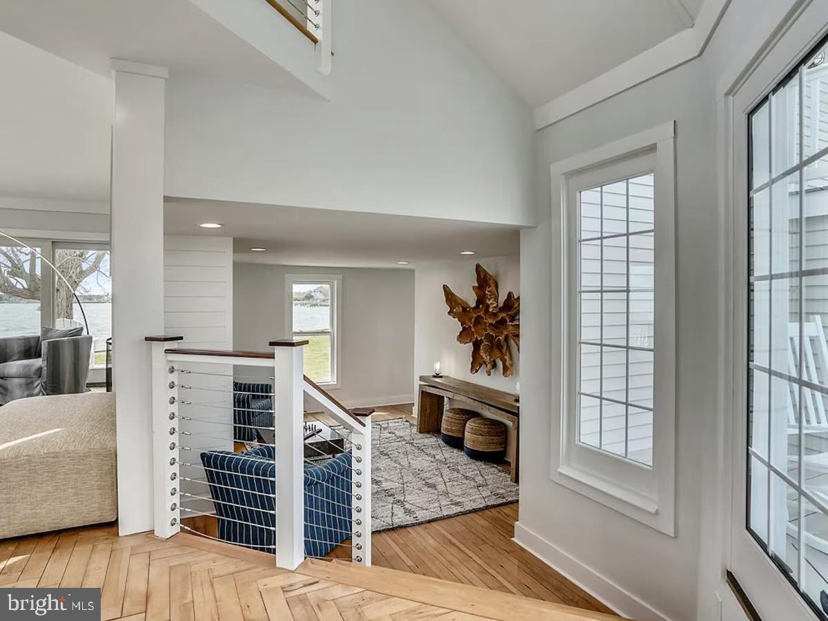 21642 Chicken Point Road Tilghman, MD 21671 - Photo 18 of 63 a view of livingroom with furniture and staircase